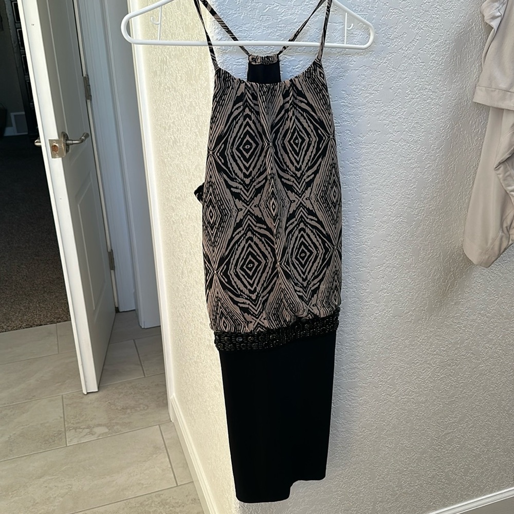 Party dress! Polyester, packs great for a cruise, wedding, etc..excellent shape